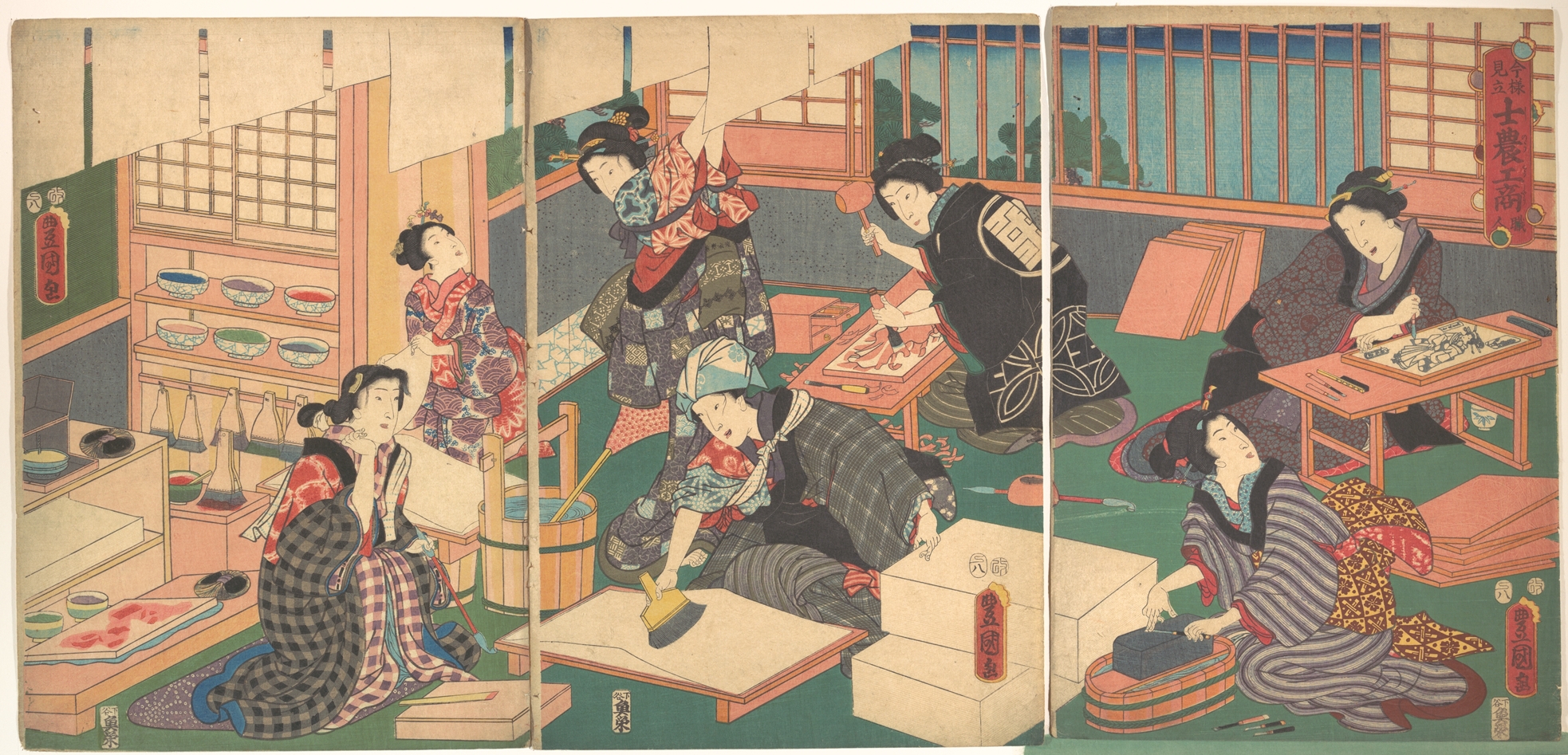 Women in a workshop at each stage of making a woodblock print—preparing the paper, carving the blocks and printing with a baren—with finished sheets hanging up to dry