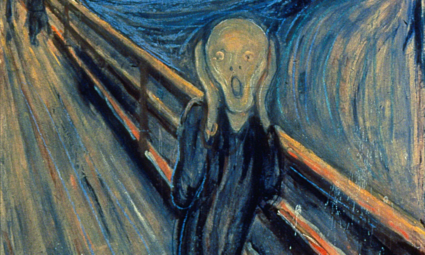 Detail of Munch's The Scream: the figure presses its hands to its face, its mouth wide open, before the diagonal railing and the swirling blue landscape.